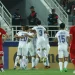 Para pemain Uzbekistan melakukan selebrasi setelah terjadi gol bunuh diri pemain Indonesia saat pertandingan semifinal Piala Asia U23 antara kedua tim di Abdullah Bin Khalifa Stadium, Doha, Senin (29/4/2024). (Photo by KARIM JAAFAR / AFP) (AFP/KARIM JAAFAR)