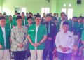 Mas Ibin (rompi Ansor tengah) bersama peserta Konfercab XV GP Ansor Kabupaten Blitar, di Graha NU Blitar, Sabtu (21/12/2024).